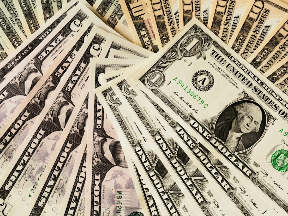 A spread of US dollar bills filling the whole picture