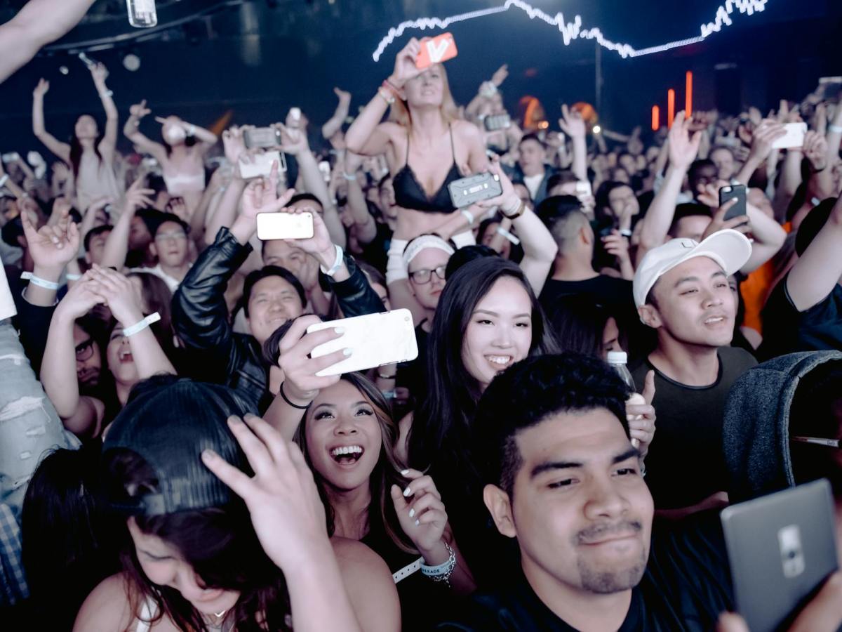 photo of people holding their smartphones